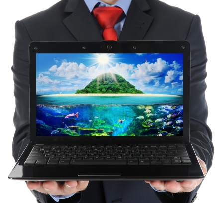 Businessman holding an open laptopの写真素材