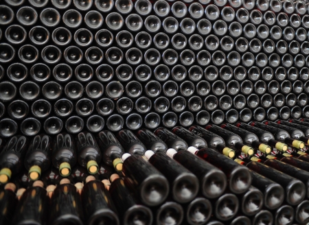 Old bottles of red wineの写真素材