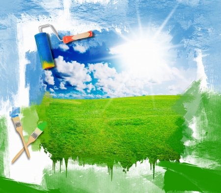 Green grass against a blue sunny skyの写真素材