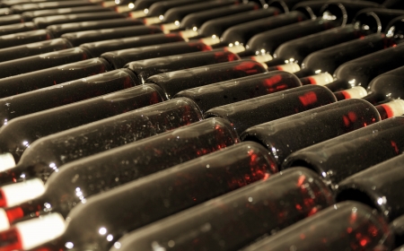 Old bottles of red wineの写真素材