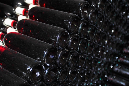 Old bottles of red wineの写真素材