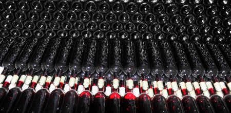 Old bottles of red wineの写真素材