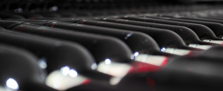 Old bottles of red wineの写真素材