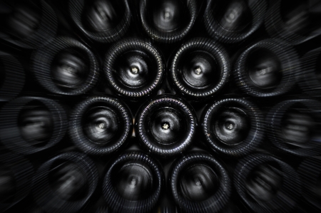 Old bottles of red wineの写真素材