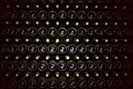 Old bottles of red wineの写真素材