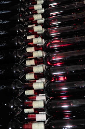 Old bottles of red wineの写真素材