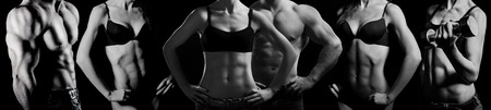 Bodybuilding. Strong man and a woman posing on a black backgroundの写真素材