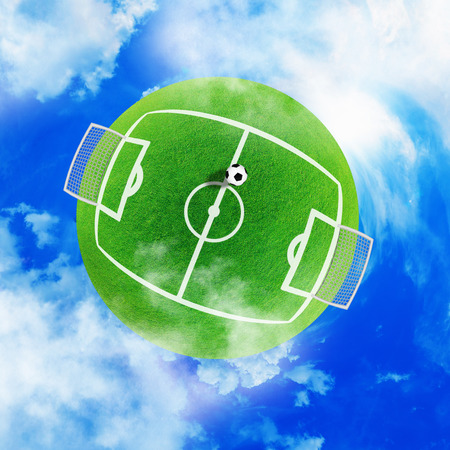 Football green planet in the sky clouds Soccer stadiumの写真素材