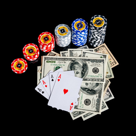 Poker Combination chips Playing cards and dollars in casinoの写真素材