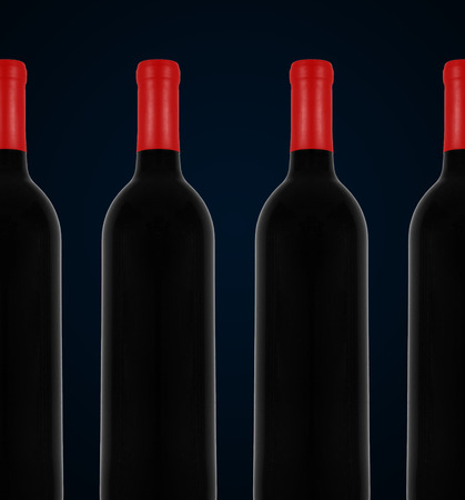 red wine and a bottle over  black backgroundの写真素材
