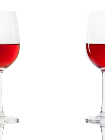 red wine in a glass isolated over white backgroundの写真素材