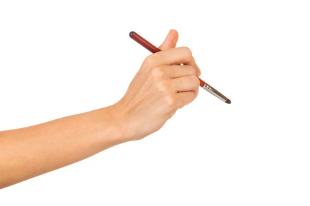 Professional make-up brush cosmetic in female hand beautician isolated on white backgroundの写真素材