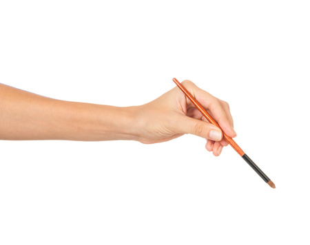 Professional make-up brush cosmetic in female hand beautician isolated on white backgroundの写真素材