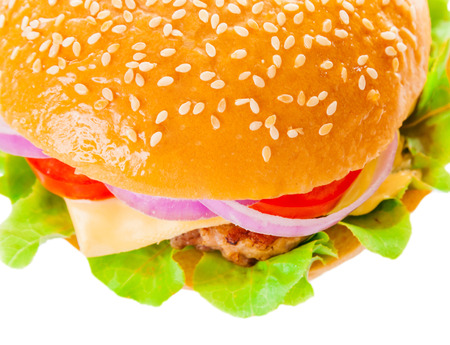 Big beautiful juicy burger with meat and vegetables. Isolated on white backgroundの写真素材