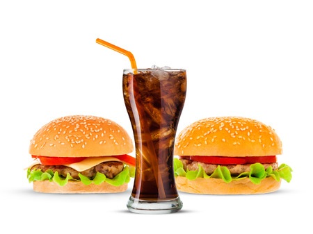 Cola and Big beautiful juicy burger with meat and vegetables. Isolated on white backgroundの写真素材
