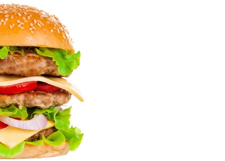 Big beautiful juicy burger with meat and vegetables. Isolated on white backgroundの写真素材