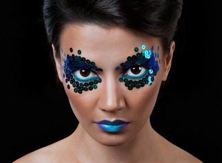 Close-up portrait of beautiful woman with professional make-up Fashion Model Girl. black backgroundの写真素材
