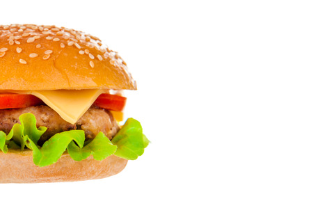 Big beautiful juicy burger with meat and vegetables. Isolated on white backgroundの写真素材