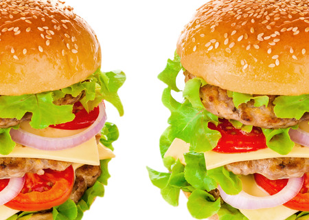 Big beautiful juicy burger with meat and vegetables. Isolated on white backgroundの写真素材