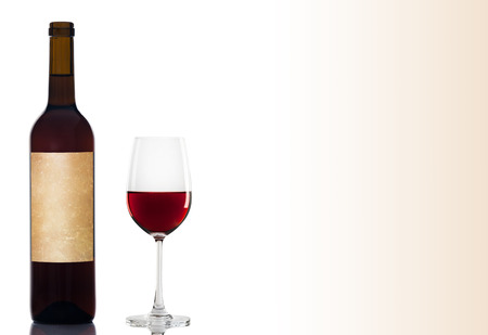 Red wine in a glass isolated over white backgroundの写真素材