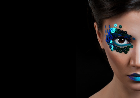 Close-up portrait of beautiful woman with professional make-up Fashion Model Girl. black backgroundの写真素材