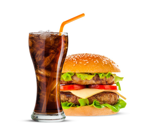 Cola and Big beautiful juicy burger with meat and vegetables. Isolated on white backgroundの写真素材