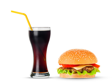 Cola and Big beautiful juicy burger with meat and vegetables. Isolated on white backgroundの写真素材
