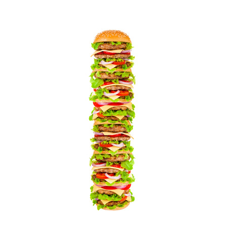 Big beautiful juicy burger with meat and vegetables. Isolated on white backgroundの写真素材