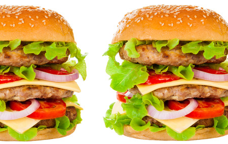 Big beautiful juicy burger with meat and vegetables. Isolated on white backgroundの写真素材