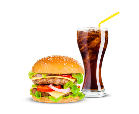Cola and Big beautiful juicy burger with meat and vegetables. Isolated on white backgroundの写真素材