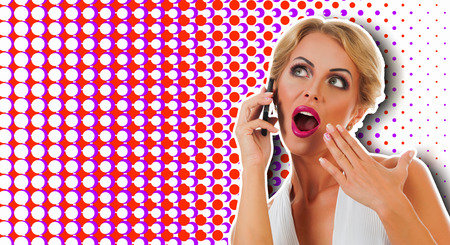 Portrait happy young woman talking on mobile phone on color backgroundの写真素材