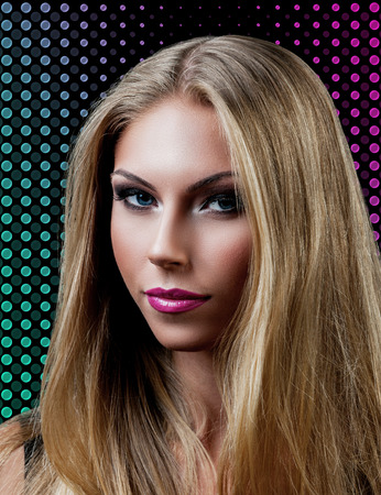 Professional Make up concept. Portrait of young beautiful woman with beauty makeup and perfect skin. on color backgroundの写真素材