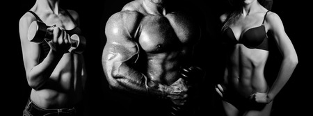 Bodybuilding. Strong man and a woman posing on a black backgroundの写真素材