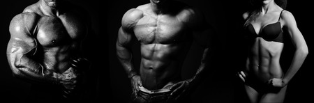 Bodybuilding. Strong man and a woman posing on a black backgroundの写真素材