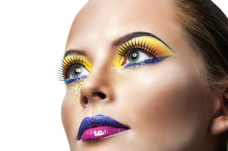 Professional Make up concept. Portrait of young beautiful woman with beauty makeup and perfect skin. Isolated on white backgroundの写真素材