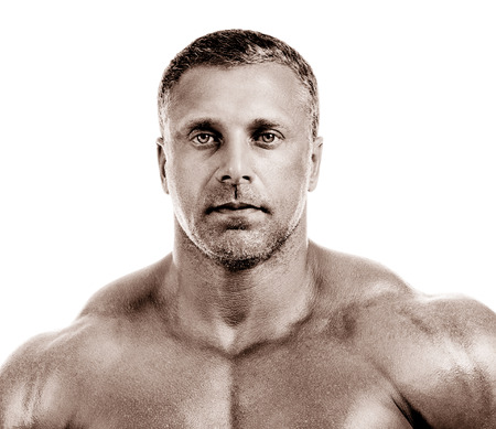 bodybuilder posing. Handsome power athletic guy male. Fitness muscular body.  Isolated on white backgroundの写真素材