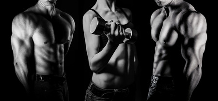 Bodybuilding. Strong man and a woman posing on a black backgroundの写真素材