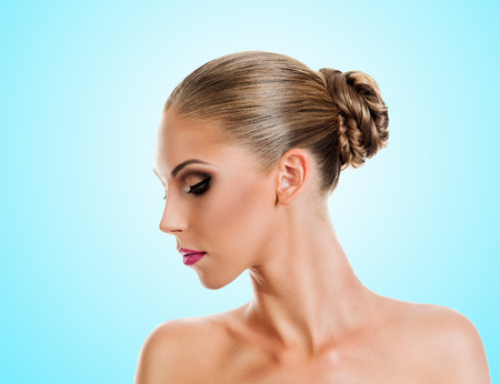 Professional Make up concept. Portrait of young beautiful woman with beauty makeup and perfect skin. on color backgroundの写真素材