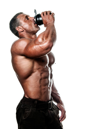 bodybuilder posing. Handsome power athletic guy male. Fitness muscular body.  Isolated on white backgroundの写真素材