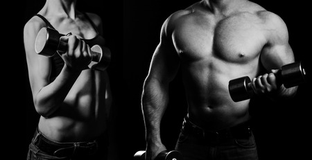 Bodybuilding. Strong man and a woman posing on a black backgroundの写真素材