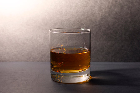 glass with whiskey on a dark background. High quality photoの写真素材