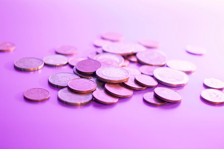 coins of different denominations on a lilac background. High quality photoの写真素材