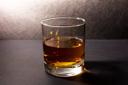 glass goblet with whiskey on a dark background. High quality photoの写真素材