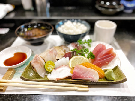 Sashimi on a plate with chopsticks in a Japanese restaurant. Fresh raw fish. High quality photoの写真素材