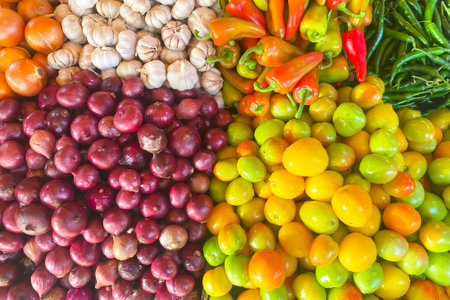 Fresh vegetables at the farmers market, tomatoes, onions, pepper, garlic.の写真素材