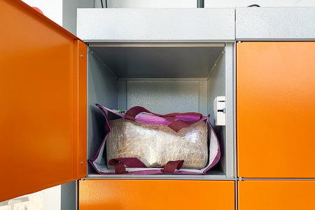 strange parcel in the self-service slot of the parcel terminal.の写真素材