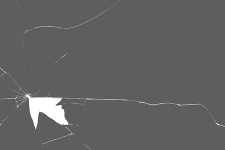 bullet hole in broken glass on a white background. black glass. shards of glass. Transparent PNG.の写真素材
