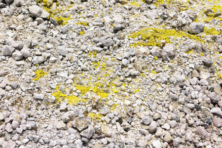 natural Sulfur appears on the surface of limestone in volcanic rock on a volcano.の写真素材