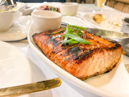 tuna steak on a table in a restaurantの写真素材