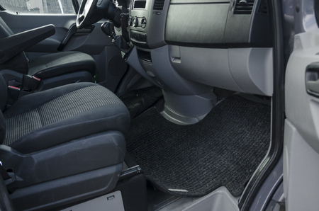 Black car interior close up. Driver's seats in front of the machine. Transport saloon concept.の写真素材